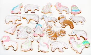 homemade Christmas festive glazed gingerbread cookie - many figure cookies on white background