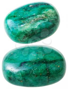 natural mineral gem stone - two green beryl gemstone pebbles isolated on white background close up