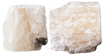 macro shooting of specimen natural rock - two pieces of gypsum (alabaster) mineral stone isolated on white background
