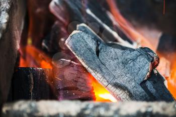 burning wooden coals in the forge furnace close up