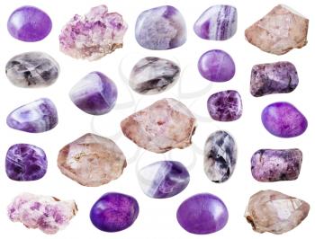 set of various amethyst crystals and gemstones isolated on white background