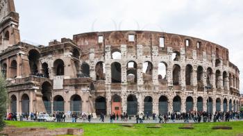 Travel to Italy - tourists near Coliseum in Rome city in winter