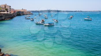 travel to Italy - boats in sea near promenade foro italico in syracuse city in Sicily