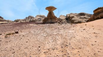 Travel to Middle East country Kingdom of Jordan - view of Mushroom rock in Wadi Rum desert in sunny winter day