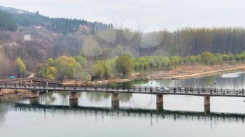 travel to China - view of Manshui Bridge on Yi river in Longmen Caves area in spring season