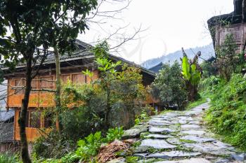 travel to China - wet patway in hill of Dazhai village in area of Longsheng Rice Terraces (Dragon's Backbone terrace, Longji Rice Terraces) in spring season