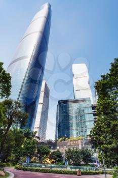 GUANGZHOU, CHINA - APRIL 1, 2017: square in park and skyscrapers in Zhujiang New Town of Guangzhou city in spring. Guangzhou is the third most-populous city in China with population about 13,5 mln