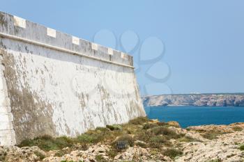 Travel to Algarve Portugal - outside wall of Fortress of Sagres on Cape St. Vincent (Cabo de Sao Vicente) near Sagres town