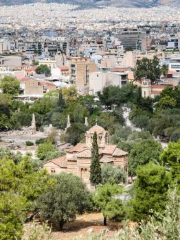 travel to Greece - above view of Church of the Holy Apostles (Holy Apostles of Solaki , Agii Apostoli) in Ancient Agora and Athens city