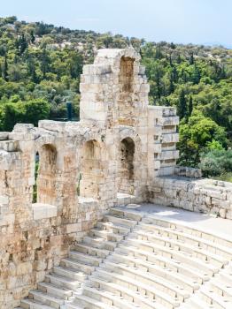 travel to Greece - wall and seats in Odeon of Herodes Atticus stone theatre at Acropolis and Athens city