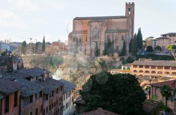 travel to Italy - view of Basilica di San Domenico (Basilica Cateriniana) in Siena city on hill in winter