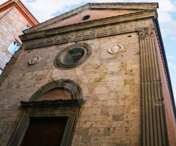 travel to Italy - facade of Church Saint Maria of Snows (Santa Maria delle Nevi) on Via Banchi di Sopra in Siena city in winter