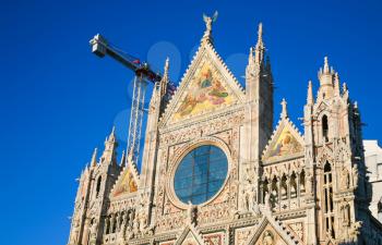 travel to Italy - facade of Siena cathedral (Duomo di Siena) in sunny winter day