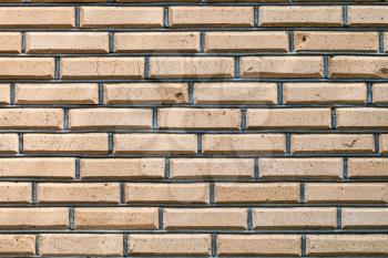 background from outdoor yellow brown brick wall