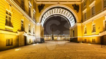 passage in Arch of General Staff Building on Bolshaya Morskaya Street to Palace Square in Saint Petersburg city in night snowfall
