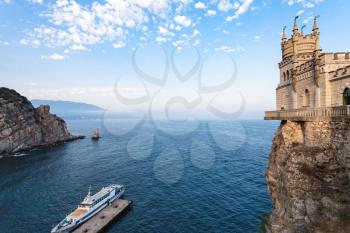 travel to Crimea - above view of ship and Swallow Nest castle over Black Sea on Crimean Southern Coast in evening