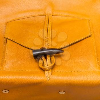 pocket of handmade yellow leather bag close up
