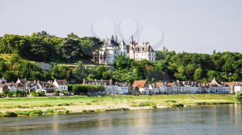 Travel to France - view of houses on island Ile d'Or and castle in Amboise town near Loire river in Val de Loire region in summe