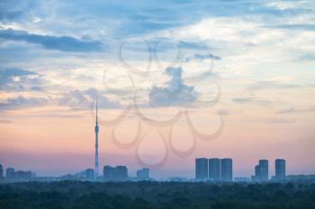 blue and pink sunrise sky over Moscow city with Ostankino TV Tower and Timiryazevskiy park in summer morning