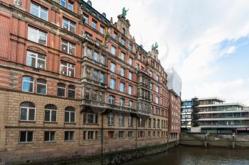 Travel to Germany - view of brick house on waterfront of Nikolaifleet canal from Trostbrucke bridge in Hamburg city downtown in september