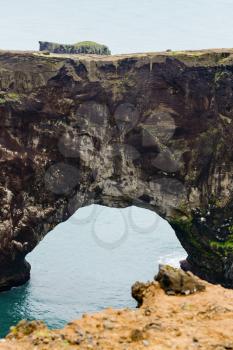 travel to Iceland - natural arch in Dyrholaey promontory near Vik I Myrdal village on Atlantic South Coast in Katla Geopark in september