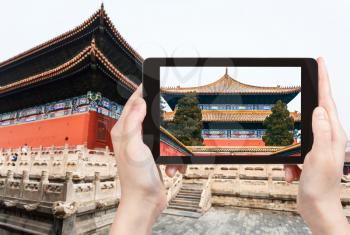 travel concept - tourist photographs Imperial Ancestral Temple (Taimiao, Working People's Cultural Palace) in Beijing Imperial city in spring on tablet