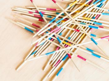 wooden sticks of Mikado pick-up sticks game close up on table