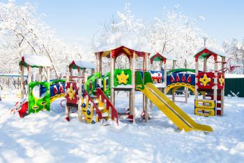public children playground at residential district in Moscow city in sunny winter day