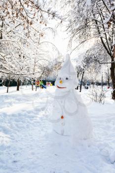 snowman in public garden in Moscow city in winter day