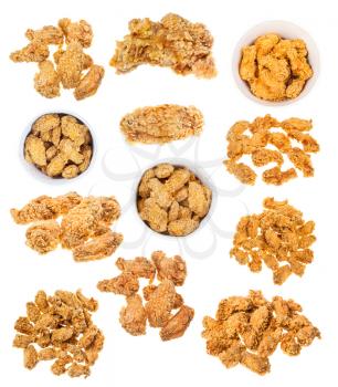 collection of hot fried spicy breaded chicken wings isolated white background