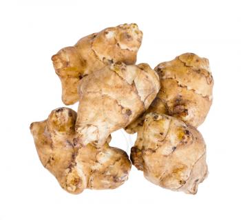 top view of pile from several raw tubers of jerusalem artichoke (sunroot) isolated on white background