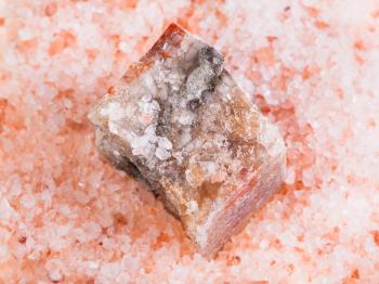 top view of natural raw Halite mineral in grained pink Himalayan Salt close up