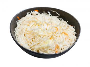 Russian sauerkraut (sour cabbage pickled with carrots and served as salad) in black bowl isolated on white background