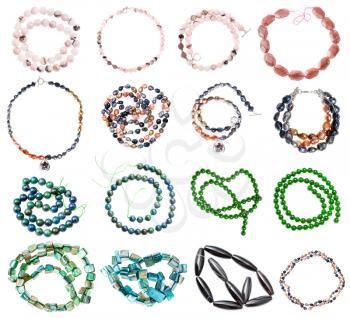 collection of various strings of beads from gemstones (rose quartz, nephrite, jade, nacre, river pearls, aventurine, agate, azurite, malachite) isolated on white background
