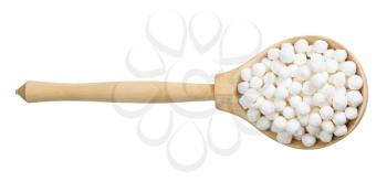 top view of raw tapioca pearls in wood spoon isolated on white background