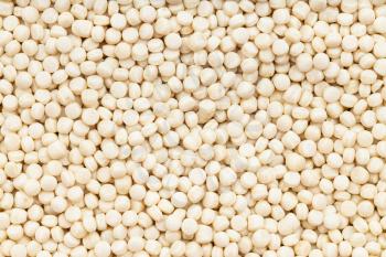 food background - many israeli pearl couscous grains close up