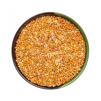 top view of chumiza siberian millet seeds in round bowl isolated on white background