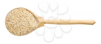 top view of wood spoon with crushed pot barley groats isolated on white background