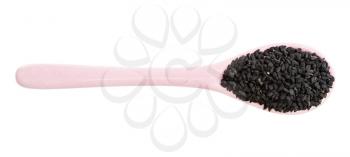 top view of ceramic spoon with nigella seeds isolated on white background