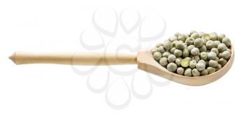 wooden spoon with whole dried green peas isolated on white background