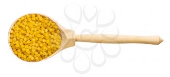 top view of wood spoon with uncooked ptitim pasta (Israeli couscous) isolated on white background