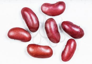 several raw kidney beans close up on gray ceramic plate