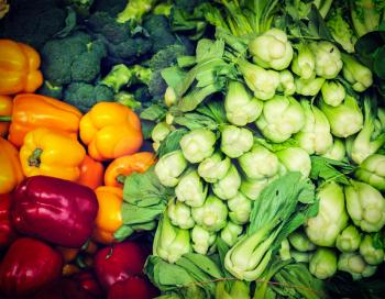 Vintage retro effect filtered hipster style image of Vegetables in Asian market close up - Capsicum bell peppers, broccoli  cabbage, Green chinese cabbage