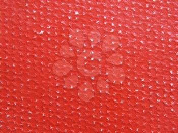 Rubbed red paper texture as background.