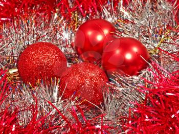 Red christmas balls and multicolored decoration.