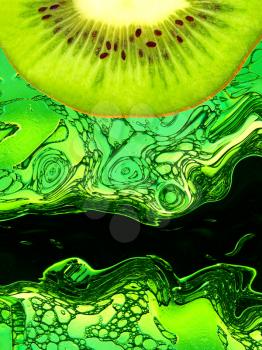 Kiwi slice taken closeup on green abstract background.Digitally generated image.