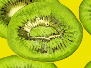 Green kiwi on a yellow taken closeup suitable as food background.Digitally generated image.