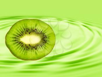 Slice of ripe kiwi taken closeup on green background.Digitally generated image.
