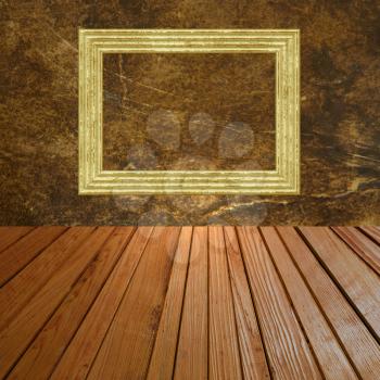 Grunge abstract background with golden picture frame on wall and wooden plank floor.
