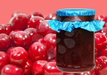 Cherry jam jar taken closeup on a ripe berries background.
